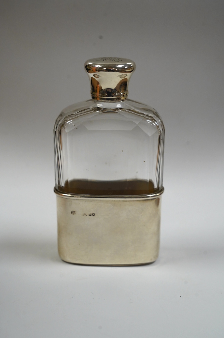 A Victorian silver mounted cut glass spirit flask, with engraved monograms, by Thomas Johnson II, London, 1876, 12cm. Condition - fair to good